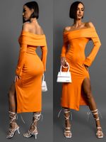 Oranžové strečové šaty KOANTES s rozparkem Velikost: M/L