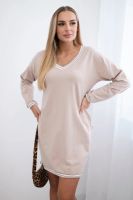 Dress with pockets and beige V-neckline
