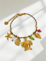 Złota bransoletka Afrodyta Maretta z zawieszkami morskimi