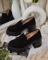 Resti Women's moccasins on a post Narvoti