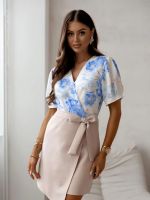 Resti Women's dress with a patterned floral top and an asymmetrical bottom with a waist belt