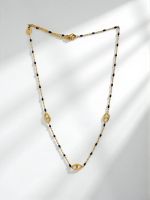 Złoty naszyjnik Aurelia Nero z czarnymi koralikami