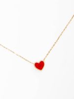 Gold necklace with red heart