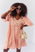 Loose dress with puff sleeves in light orange