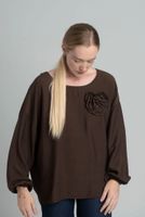 Oversized chocolate blouse with a decorative flower