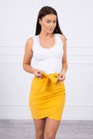 Wrap skirt tied at the waist with mustard